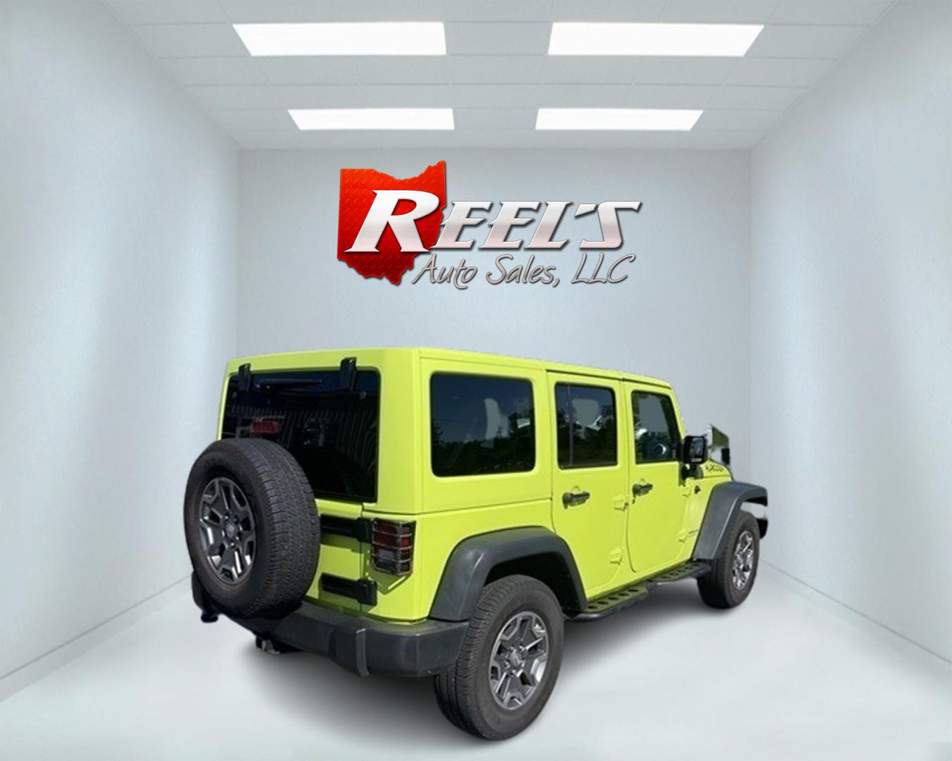 2017 Green /Black Jeep Wrangler Unlimited Rubicon 4WD (1C4BJWFG2HL) with an 3.6L V6 DOHC 24V engine, 5-Speed Automatic transmission, located at 11115 Chardon Rd. , Chardon, OH, 44024, (440) 214-9705, 41.580246, -81.241943 - This 2017 Jeep Wrangler Unlimited Rubicon is a rugged and capable off-road vehicle, equipped with a range of premium features. The exterior boasts LED headlights and fog lights, while the interior features a single-zone automatic climate control system, a 9-speaker Alpine sound system, and navigatio - Photo#5